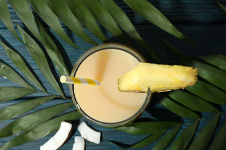 Pina colada cocktail on blue wooden table.の写真素材