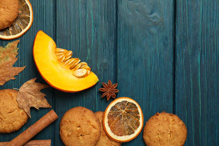 Pumpkin cookies on blue wooden background, space for text.の写真素材