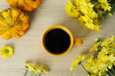 Autumn composition with chrysanthemums on wooden background.の写真素材