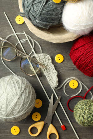 Knitting yarn concept on gray wooden background.の写真素材