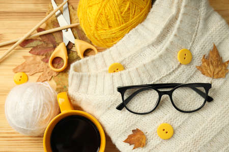 Concept of knitting with yarn balls on wooden table.の写真素材