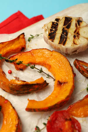 Concept of tasty food with baked pumpkin on blue background.の写真素材
