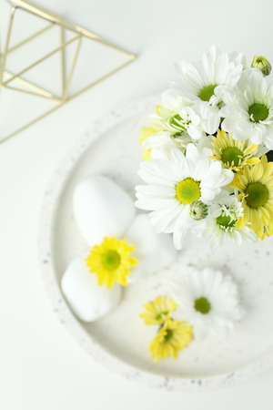 Beautiful composition with chrysanthemums on white table.の写真素材