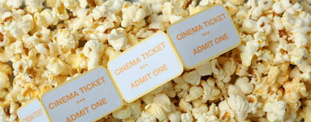 Popcorn with tickets all over background, close up.の写真素材
