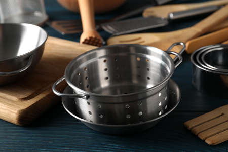 Different kitchen utensil on blue wooden background.の写真素材