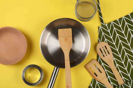 Kitchen utensil on yellow background, top view.の写真素材