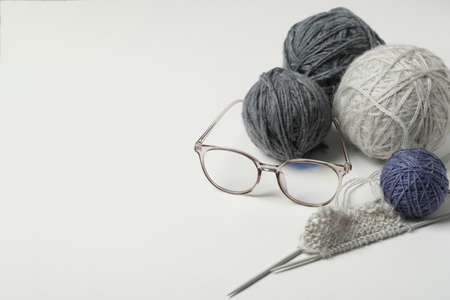 Knitting concept with balls of yarn on light background.の写真素材