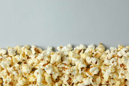 Tasty popcorn on light gray background, space for text.の写真素材