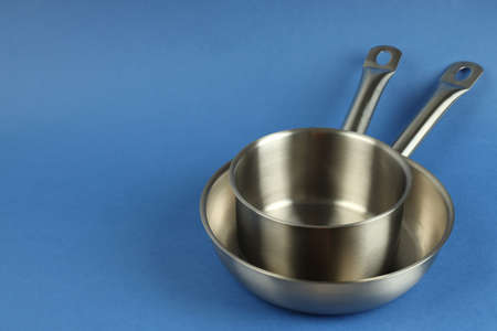 Kitchen utensil on blue background, space for text.の写真素材
