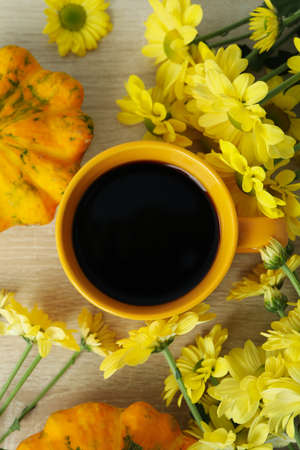 Autumn composition with chrysanthemums on wooden background.の写真素材