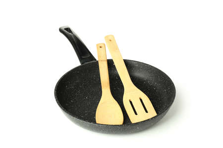 Pan with wooden utensil isolated on white background.の写真素材