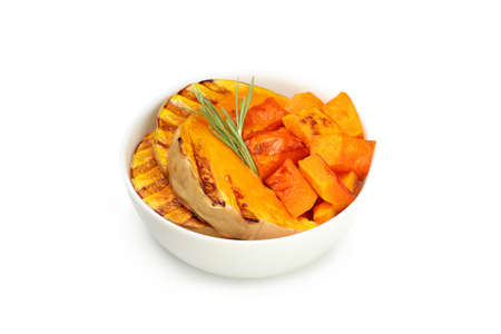 Bowl with baked pumpkin isolated on white background.の写真素材