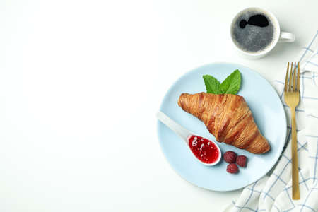 Concept of delicious food with croissant with raspberry jam on white backgroundの写真素材