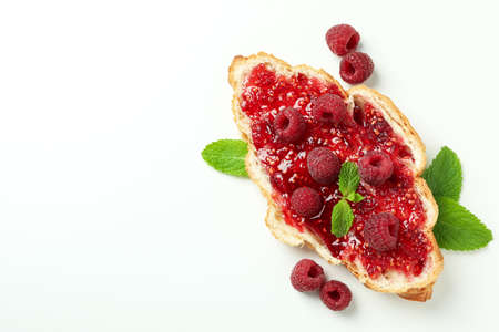 Croissant with raspberry jam on white backgroundの写真素材