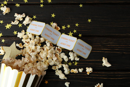 Paper box with popcorn, and tickets on wooden background.の写真素材