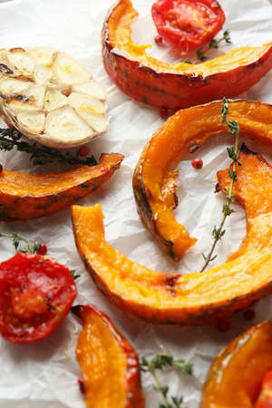 Baking paper with baked pumpkin and spices, close up.の写真素材