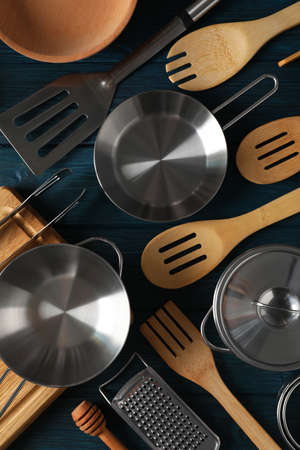 Different kitchen utensil on blue wooden background.の写真素材