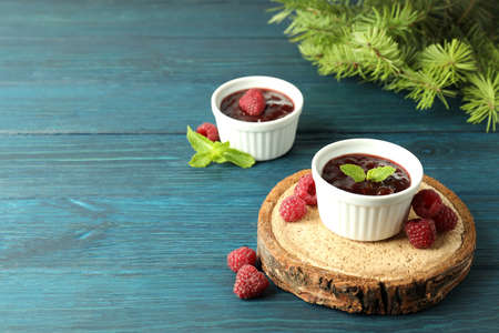 Concept of tasty food with raspberry jam on wooden backgroundの写真素材