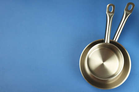 Kitchen utensil on blue background, space for text.の写真素材