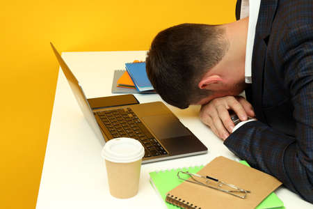 Business concept with tired working young man.
