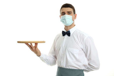 Waiter in mask holds tray, isolated on white background.の写真素材
