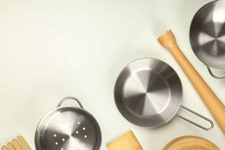 Different kitchen utensil on white background, top view.
