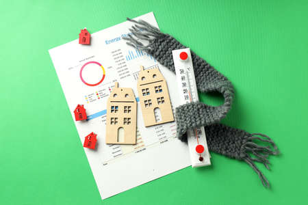 Concept of heating season on green background.の写真素材