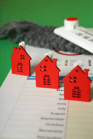 Concept of heating season on green background.の写真素材