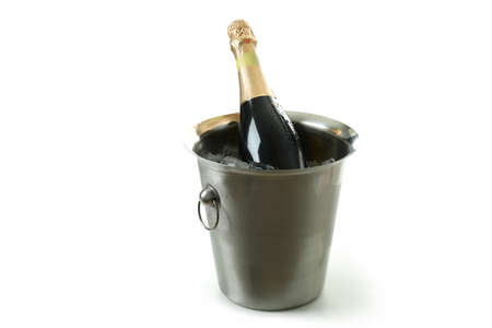 Metal bucket with ice and Champagne bottle isolated on white background.の写真素材