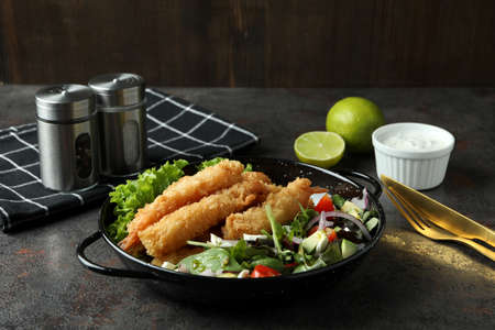 Ð¡oncept of tasty food with deep-fried shrimp on dark tableの写真素材