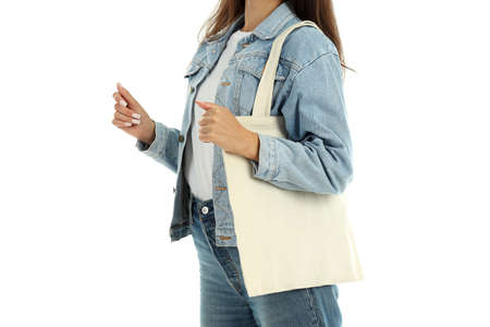 Girl with cotton bag isolated on white background.の写真素材