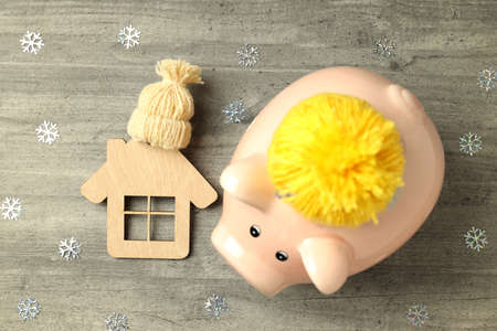 Concept of heating season with piggy bank on gray textured background.の写真素材