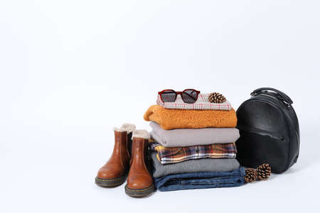 Concept of winter clothes isolated on white background.