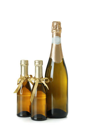 Champagne bottle and champagne bottles with bow isolated on white background.の写真素材