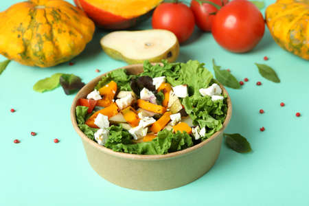Concept of healthy food with pumpkin salad on mint backgroundの写真素材