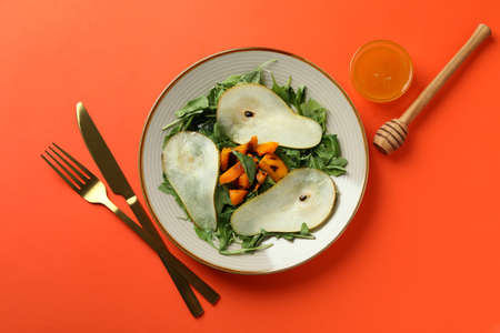 Concept of tasty eating with pumpkin salad on orange backgroundの写真素材