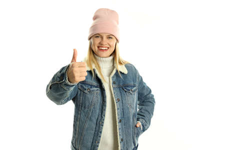 Attractive girl in winter clothes isolated on white background.の写真素材