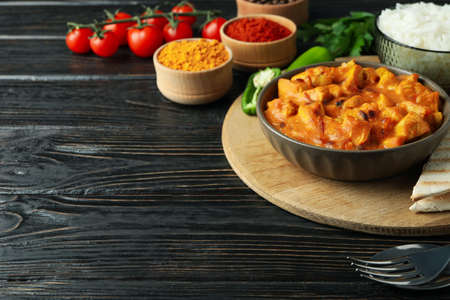 Concept of tasty food with chicken tikka on wooden backgroundの写真素材