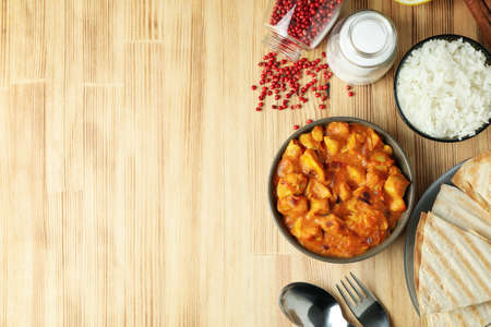 Concept of tasty food with chicken tikka on wooden backgroundの写真素材