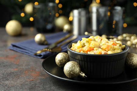 Christmas concept of tasty food with Olivier salad and bokehの写真素材