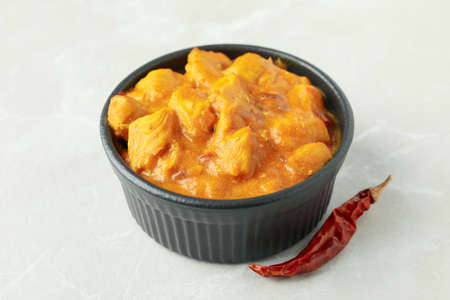 Chicken tikka with ingredients on light textured backgroundの写真素材