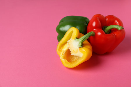 Multi-colored bell pepper on pink backgroundの写真素材