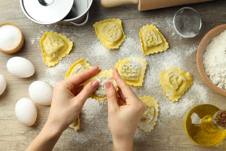 Concept of cooking ravioli on wooden backgroundの写真素材