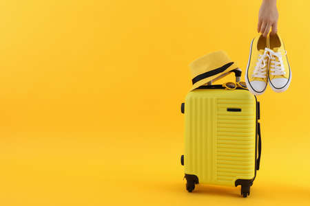 Composition with travel accessories on yellow backgroundの写真素材