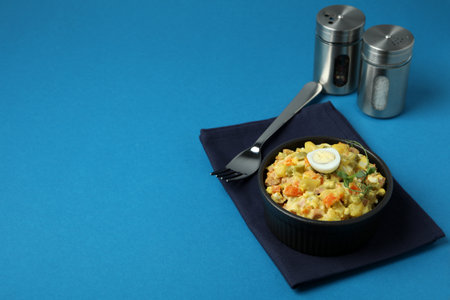 Concept of tasty food with Olivier salad on blue backgroundの写真素材