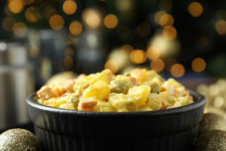Christmas concept of tasty food with Olivier salad and bokehの写真素材