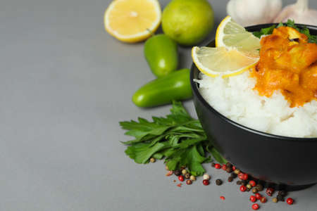 Chicken tikka with ingredients on gray backgroundの写真素材