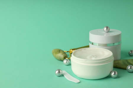 Composition with winter cosmetic products on mint background