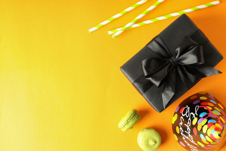 Birthday accessories on yellow background, space for textの写真素材
