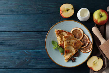 Concept of tasty food with apple pie on wooden backgroundの写真素材